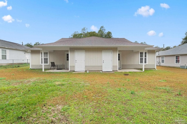 back of house featuring a patio, central AC, and a lawn