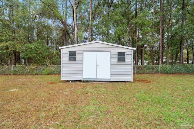 view of outdoor structure with a yard