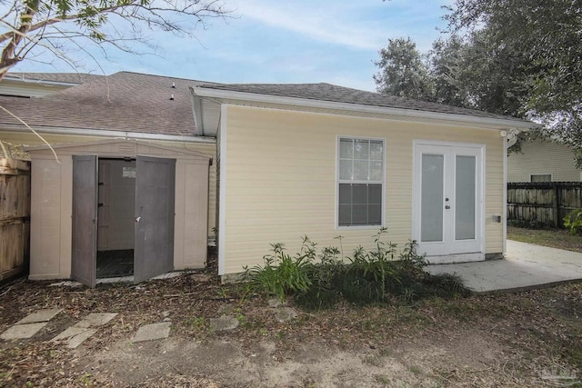 back of property featuring an outdoor structure