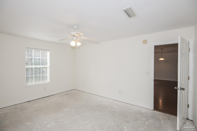 spare room with concrete flooring and ceiling fan