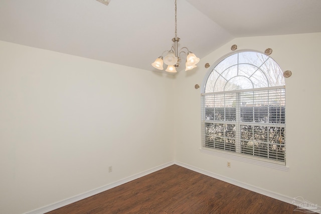 unfurnished room with vaulted ceiling, an inviting chandelier, and hardwood / wood-style floors