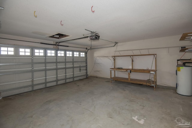 garage with a garage door opener and electric water heater