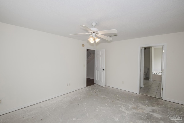 unfurnished bedroom with connected bathroom and ceiling fan