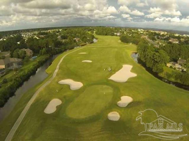 aerial view of a golf club and a large body of water