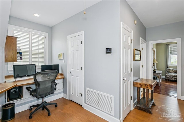 office featuring visible vents, recessed lighting, baseboards, and wood finished floors