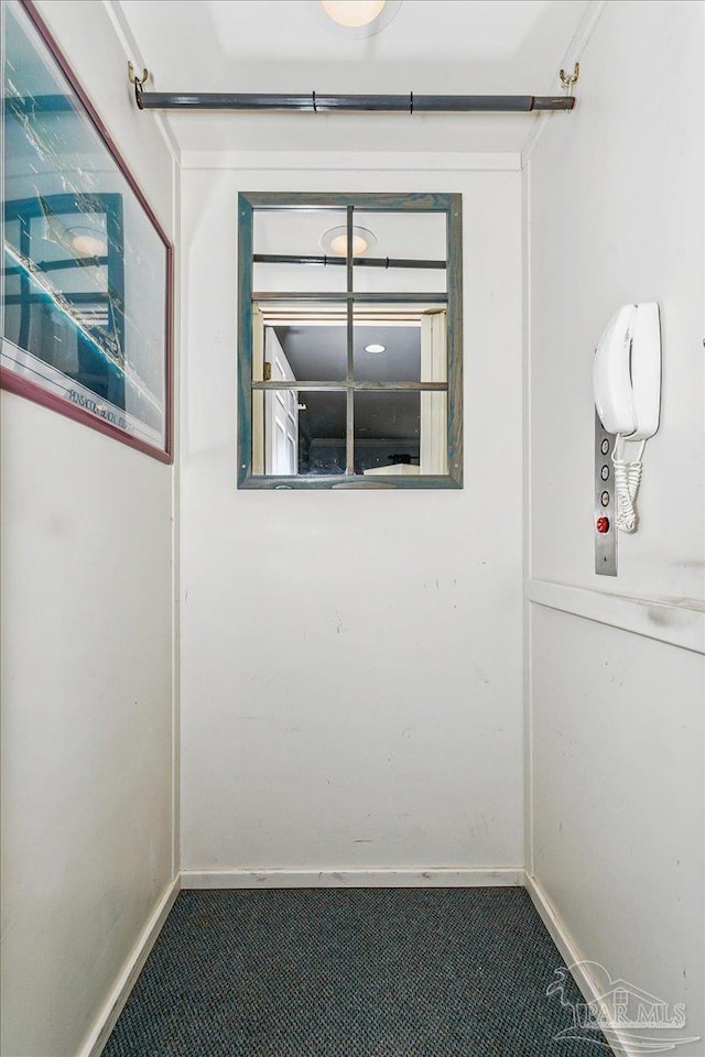 unfurnished room featuring baseboards
