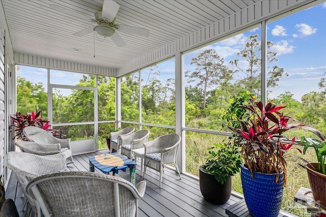 sunroom with a ceiling fan