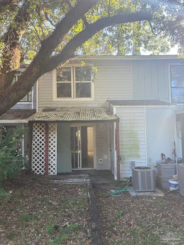 rear view of house with central air condition unit