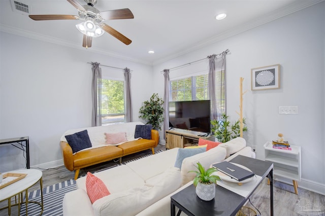 living room with ornamental molding, ceiling fan, and hardwood / wood-style floors