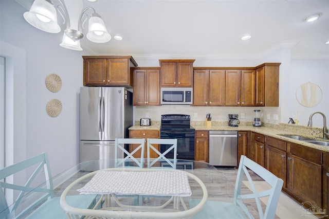 kitchen with sink, appliances with stainless steel finishes, tasteful backsplash, and light stone counters