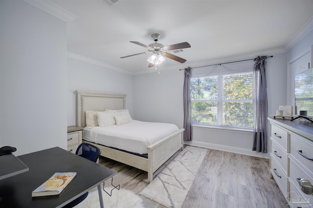 bedroom featuring ornamental molding, ceiling fan, and light hardwood / wood-style floors