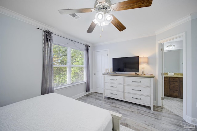 bedroom with crown molding, light hardwood / wood-style flooring, ceiling fan, and connected bathroom