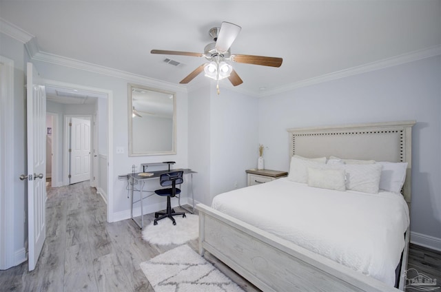 bedroom featuring crown molding, light wood-type flooring, and ceiling fan