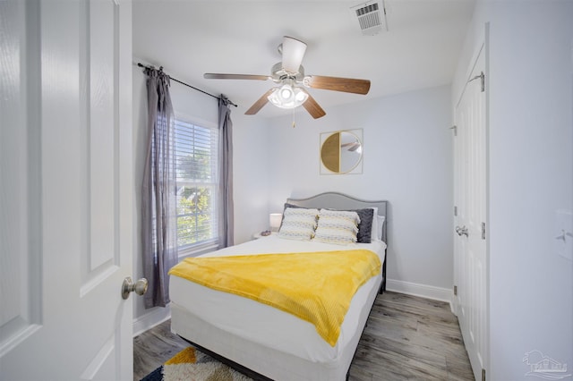 bedroom featuring wood-type flooring and ceiling fan