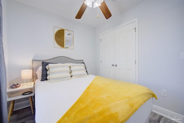 bedroom with a closet, ceiling fan, and hardwood / wood-style floors