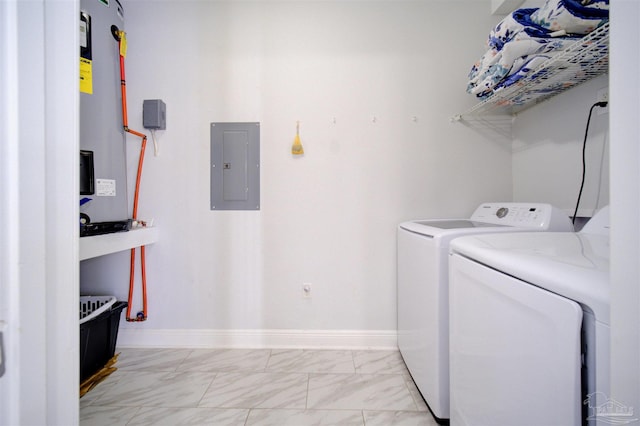 clothes washing area featuring electric water heater, independent washer and dryer, electric panel, and light tile patterned floors