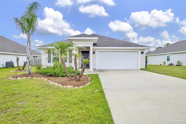 ranch-style home with a garage, central air condition unit, and a front lawn