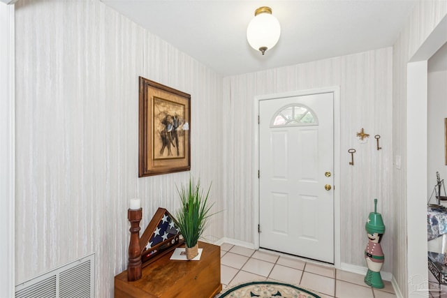 entrance foyer with light tile patterned floors