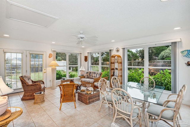 sunroom featuring ceiling fan