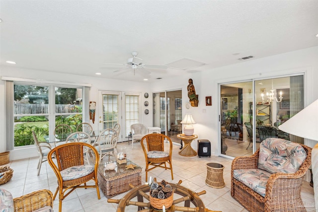 tiled living room featuring ceiling fan