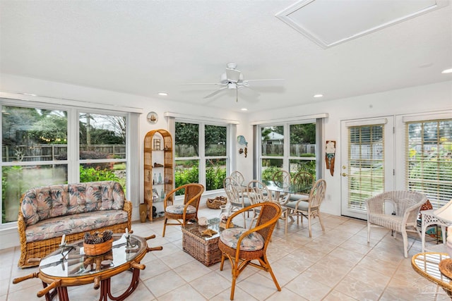 sunroom featuring ceiling fan