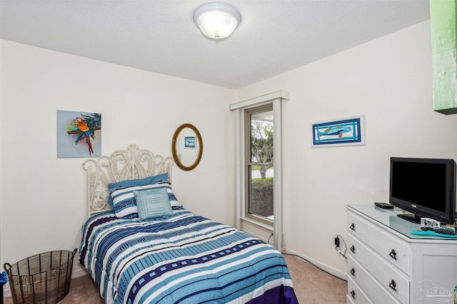 bedroom with light colored carpet