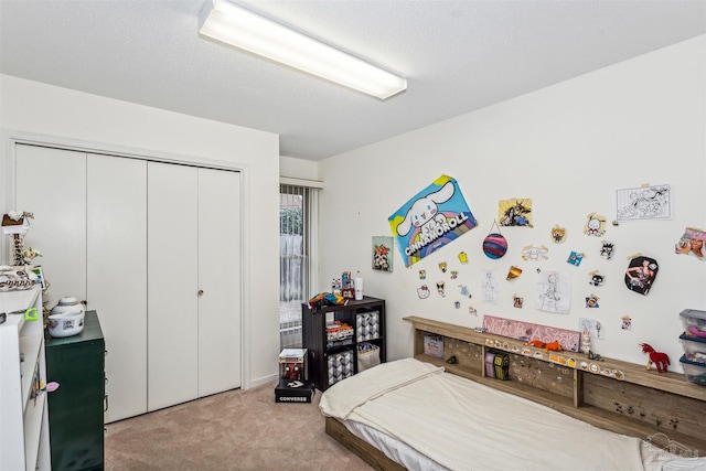 carpeted bedroom featuring a closet