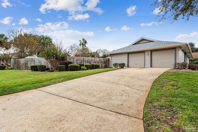 view of home's exterior with a garage and a yard