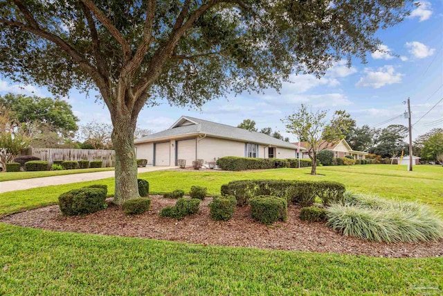 view of home's exterior with a lawn and a garage