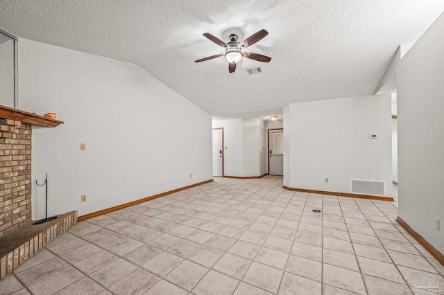 4420 Bellwood Cir, Pace, FL 32571 - unfurnished living room featuring ceiling fan, a textured ceiling, vaulted ceiling, and a brick fireplace