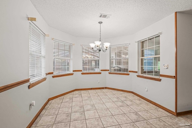 4420 Bellwood Cir, Pace, FL 32571 - unfurnished dining area featuring a chandelier and a textured ceiling