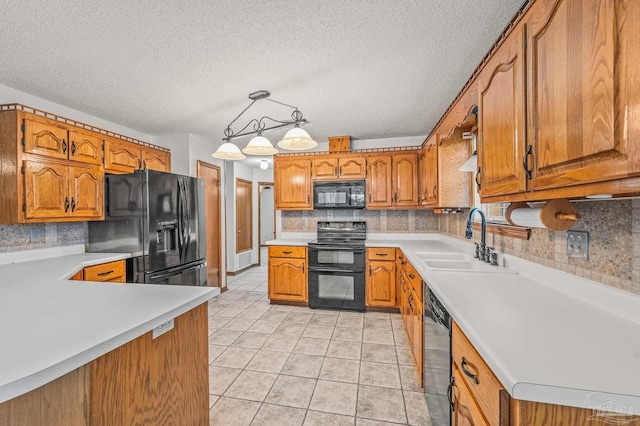 4420 Bellwood Cir, Pace, FL 32571 - kitchen with black appliances, brown cabinetry, decorative backsplash, light countertops, and light tile patterned floors