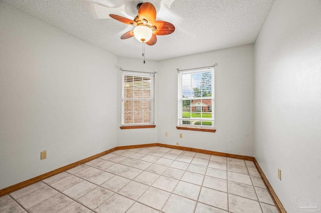 4420 Bellwood Cir, Pace, FL 32571 - empty room with a textured ceiling, a ceiling fan, and light tile patterned floors