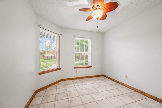 4420 Bellwood Cir, Pace, FL 32571 - unfurnished room with a textured ceiling, ceiling fan, and light tile patterned floors