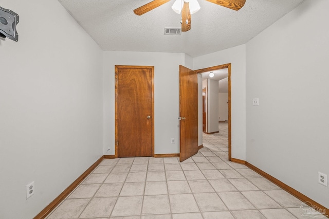 4420 Bellwood Cir, Pace, FL 32571 - unfurnished bedroom with a textured ceiling and ceiling fan