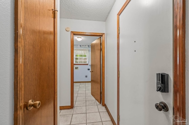 4420 Bellwood Cir, Pace, FL 32571 - hall with a textured ceiling and light tile patterned floors