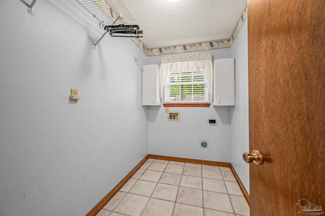 4420 Bellwood Cir, Pace, FL 32571 - laundry area with cabinet space, hookup for a washing machine, hookup for an electric dryer, a textured ceiling, and light tile patterned floors