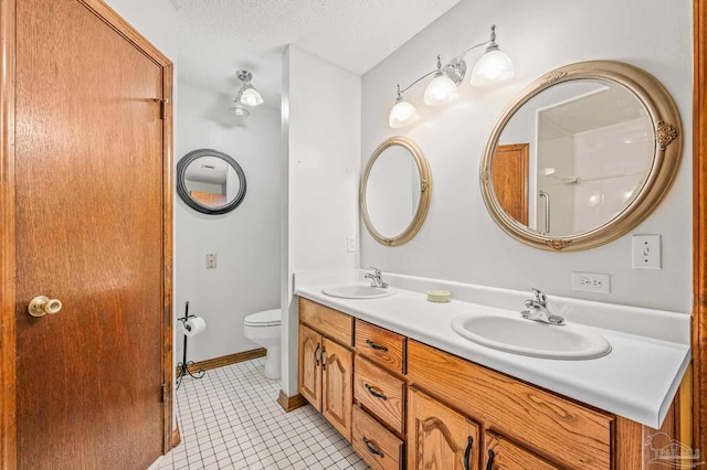 4420 Bellwood Cir, Pace, FL 32571 - full bath featuring double vanity, tile patterned floors, and a textured ceiling