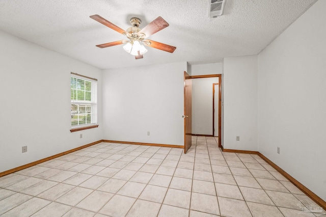 4420 Bellwood Cir, Pace, FL 32571 - spare room with a textured ceiling and a ceiling fan