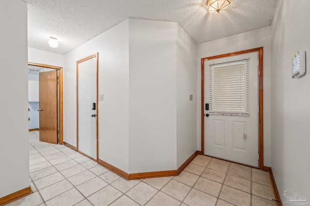 4420 Bellwood Cir, Pace, FL 32571 - entrance foyer with a textured ceiling and light tile patterned floors
