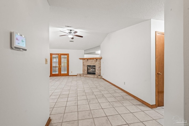 4420 Bellwood Cir, Pace, FL 32571 - unfurnished living room featuring a ceiling fan, a fireplace, light tile patterned flooring, and lofted ceiling