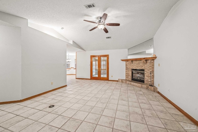 4420 Bellwood Cir, Pace, FL 32571 - unfurnished living room with lofted ceiling, ceiling fan, a textured ceiling, french doors, and light tile patterned floors