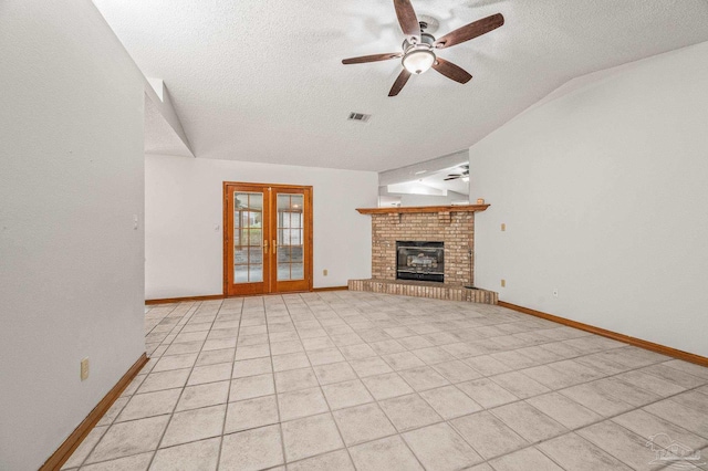 4420 Bellwood Cir, Pace, FL 32571 - unfurnished living room featuring ceiling fan, a textured ceiling, vaulted ceiling, light tile patterned floors, and french doors