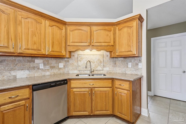 5833 Pebble Ridge Dr, Milton, FL 32583 - kitchen with dishwasher, light tile patterned floors, backsplash, brown cabinets, and lofted ceiling