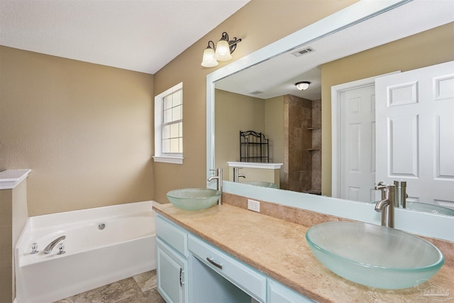 5833 Pebble Ridge Dr, Milton, FL 32583 - bathroom featuring double vanity, a garden tub, and tiled shower