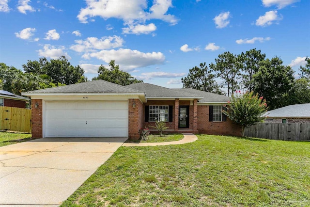 5833 Pebble Ridge Dr, Milton, FL 32583 - ranch-style home featuring an attached garage, brick siding, and concrete driveway