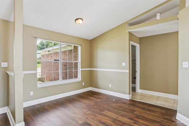 5833 Pebble Ridge Dr, Milton, FL 32583 - empty room with wood finished floors and lofted ceiling