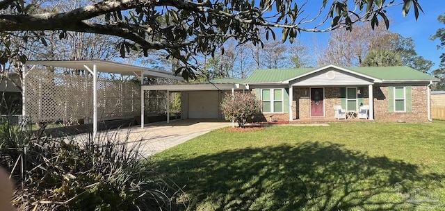 view of front of house with a front yard, a garage, and a carport