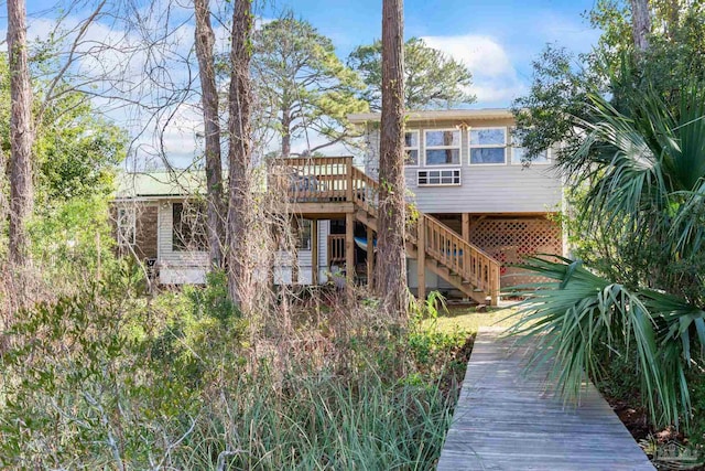 back of house with a wooden deck