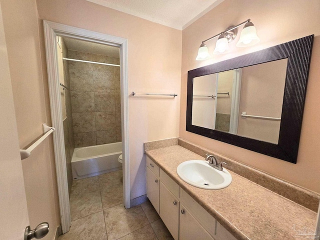 bathroom featuring shower / bathtub combination, toilet, vanity, a textured ceiling, and tile patterned flooring